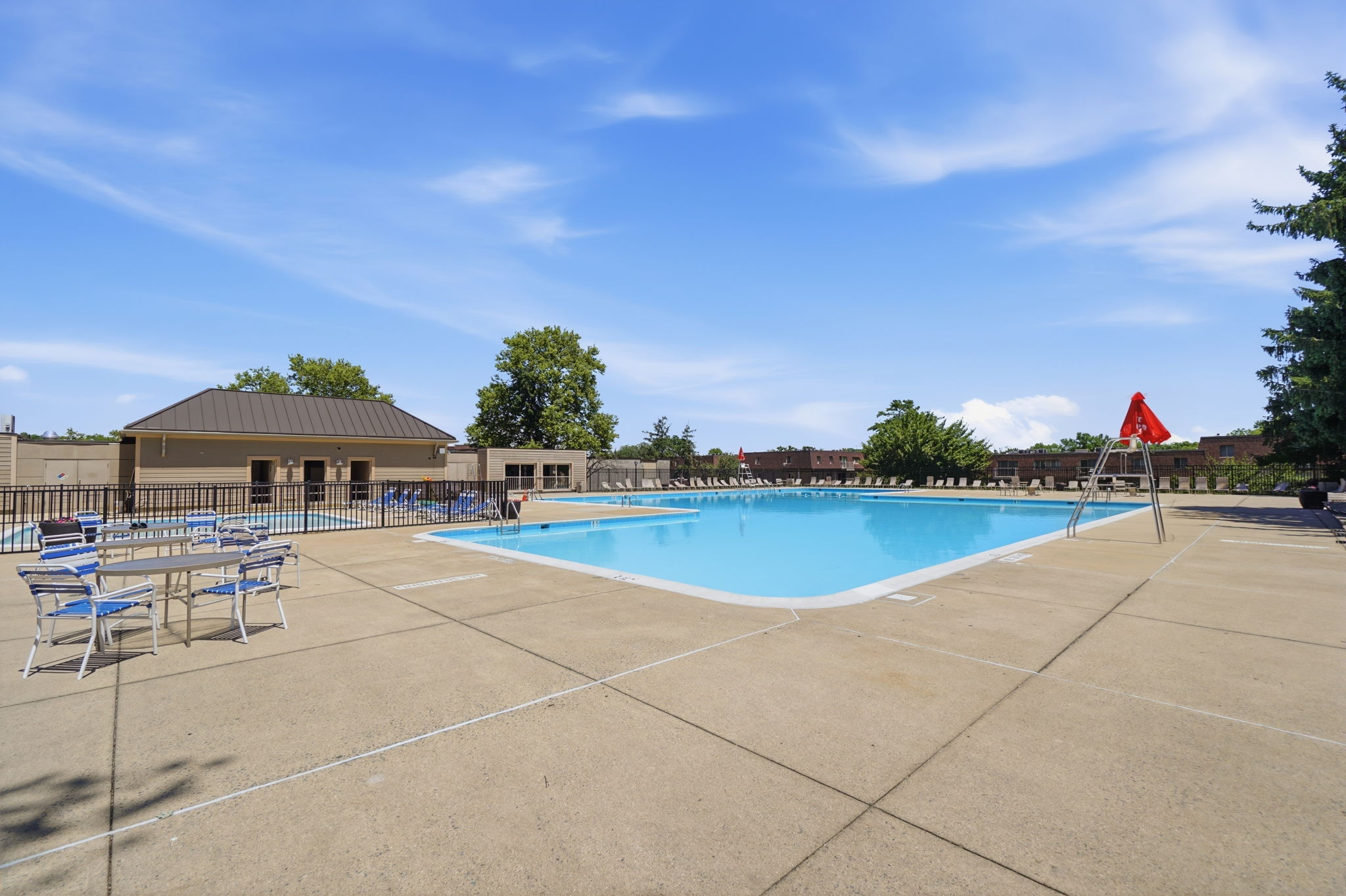 A pool with a red flag in the background.